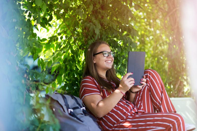 Teen Girl Reading on Tablet