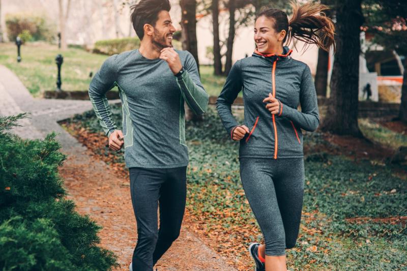Two Friends Jogging in Park