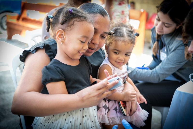 A dominican republic mother with her two daughters