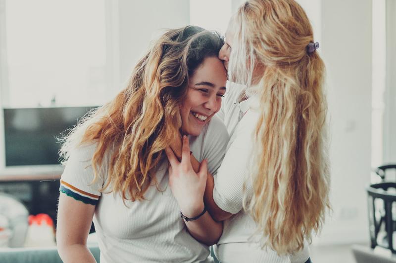 Mother Kissing Daughter on Forehead