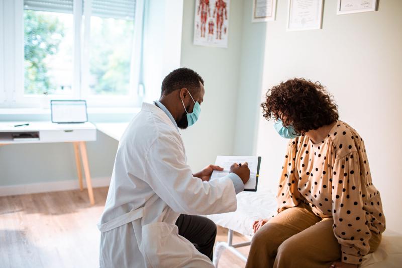 Provider and patient in an office looking at test results