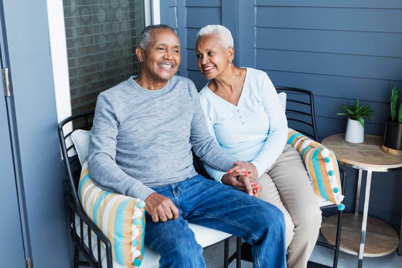 Senior couple relaxing on porch outdoors