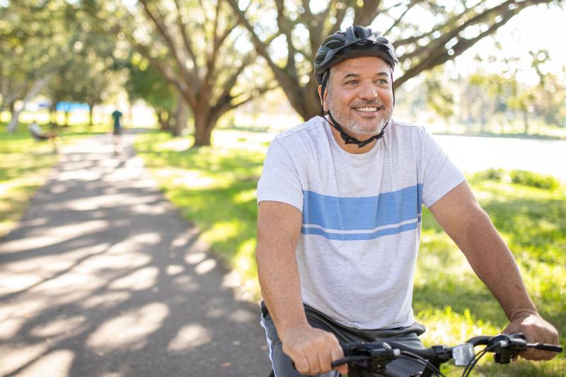 Man Riding Bike in Park