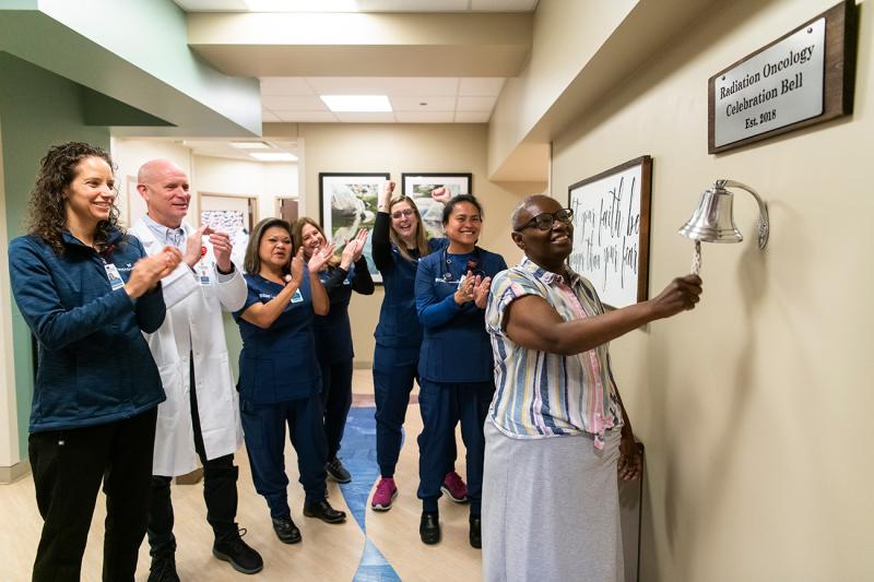 Women Ringing Radiation Oncology Bell