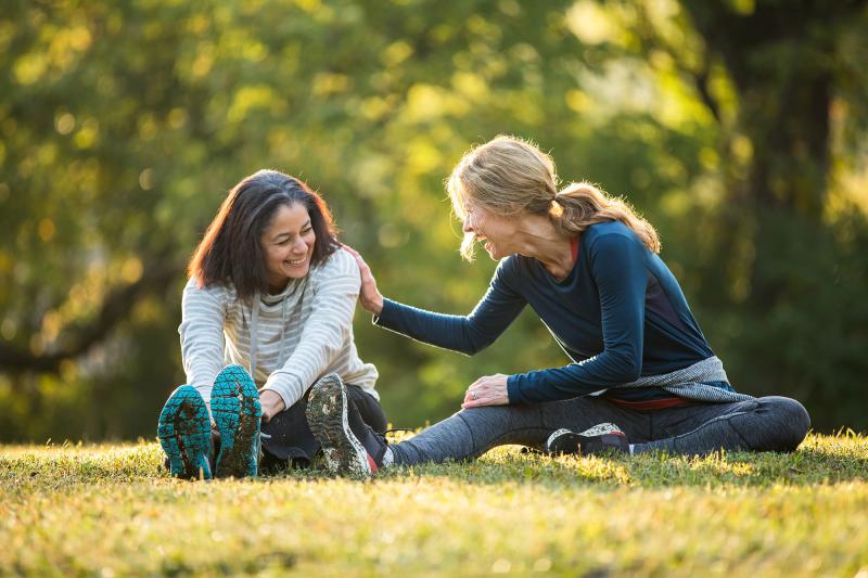 Women Stretching in Park