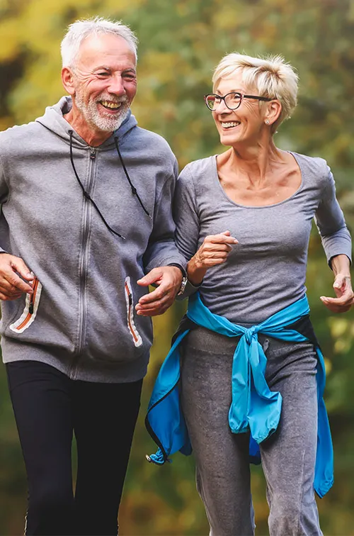 Older Couple Running in Park